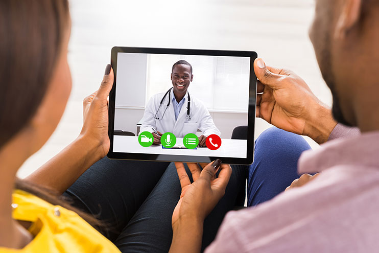 Telemedicine: A doctor consulting through a tablet device