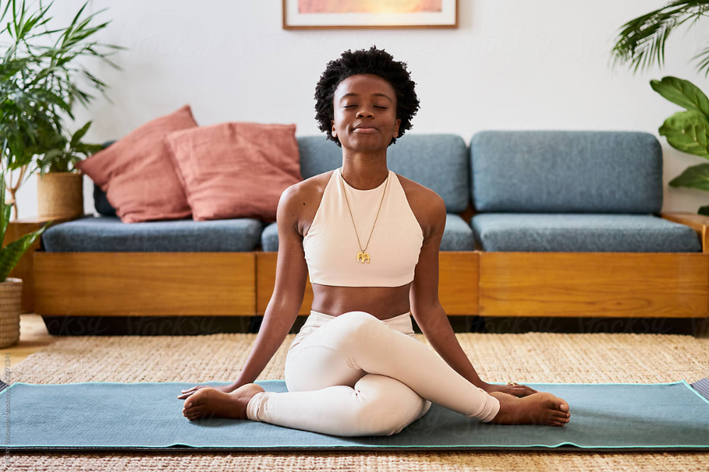 Black woman in a yoga posture: Good health